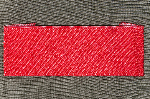 Red blank shirt label on green collar
