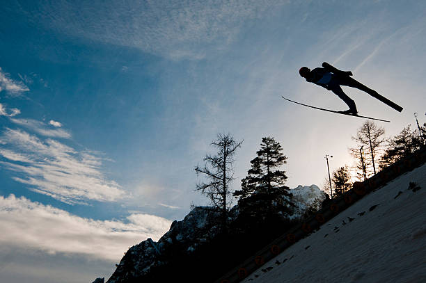 istock Silhouette of ski jumper flying 185330418