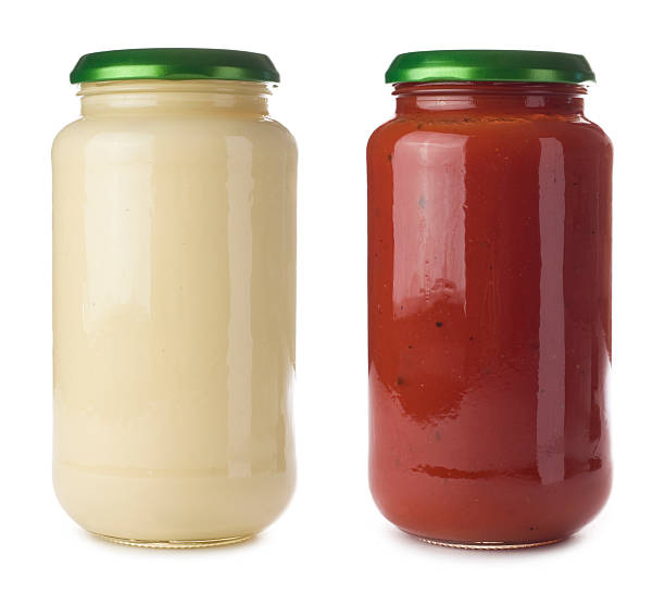 Glass pasta sauce jars on a white background