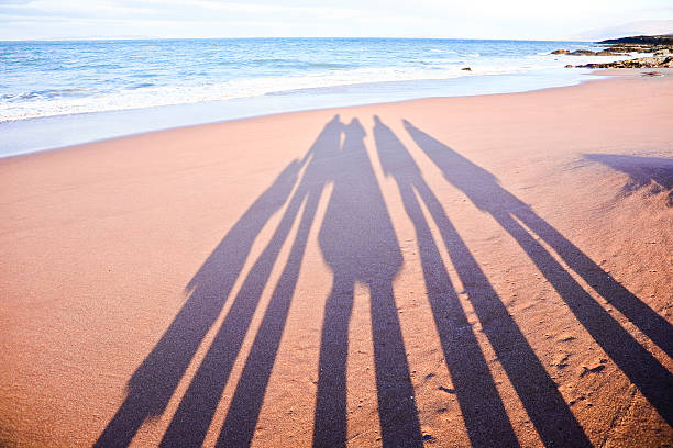 Five member family on the beach.