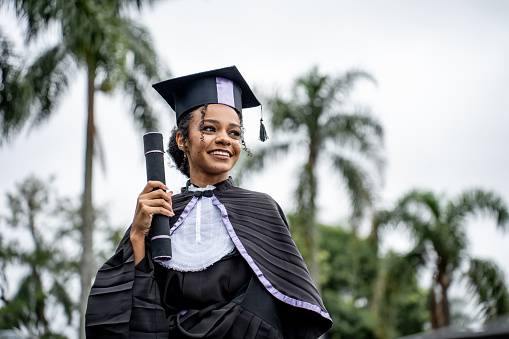 Portrait of black woman celebrating graduation day
