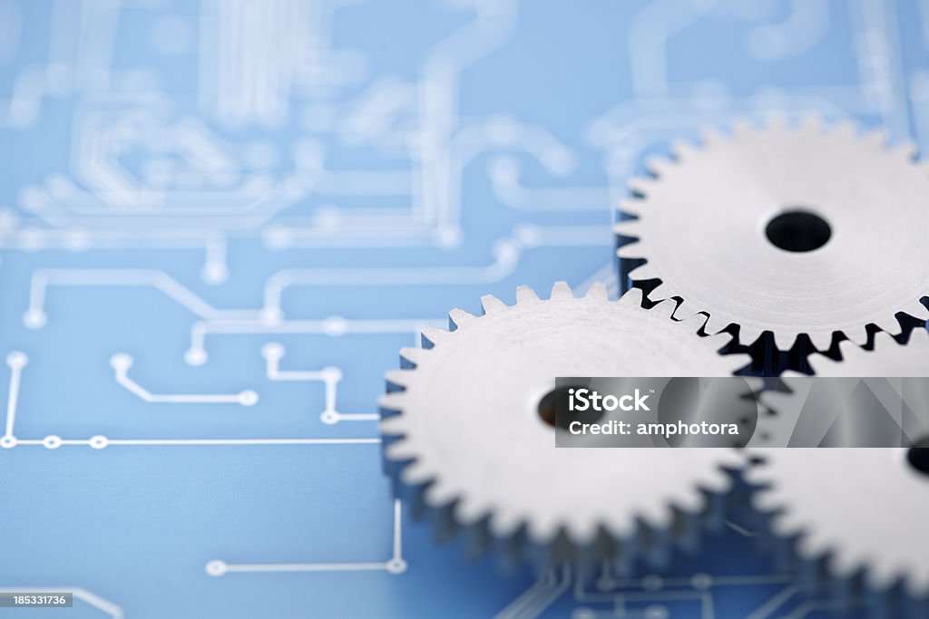 Technology background Gears and printed circuit board. Gear - Mechanism Stock Photo
