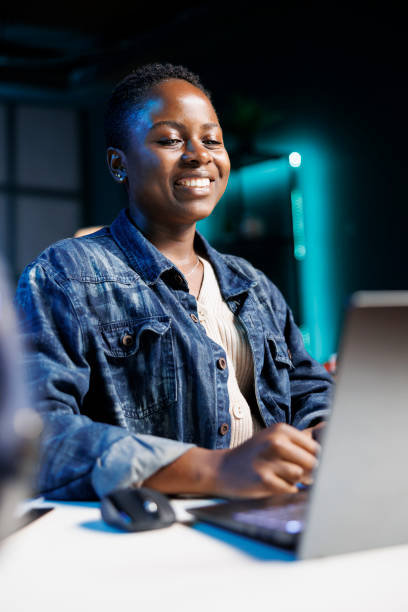 istock Joyful woman typing on digital laptop 1853341868