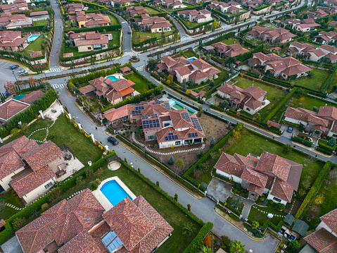 Looking over the terrace houses and treelined streets from drone perspective, Istanbul, Turkey