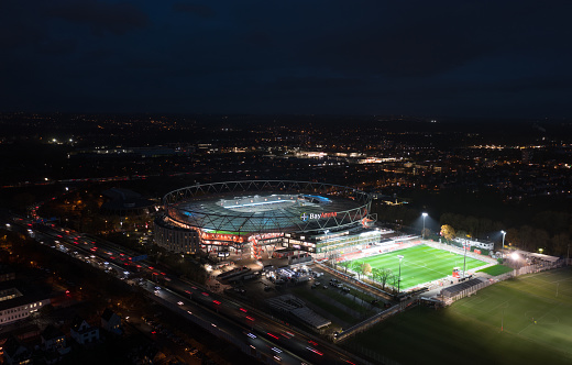 Leverkusen, North Rhine-Westphalia, Germany - November, 2023: Aerial night panorama view of the illuminated BayArena, home stadium of Bundesliga football club Bayer 04