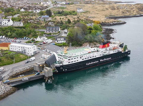 13th May 2023: Aerial drone view of the Uig to Tarbert Calendonian MacBrayne ferry that has arrived on the Isle of Harris.  Informally known as CalMac, the ferry service connects the Highlands & Islands communities and visitors. This ferry, Clansman, links Uig on the Isle of Skye with Tarbert on the Isle of Harris.