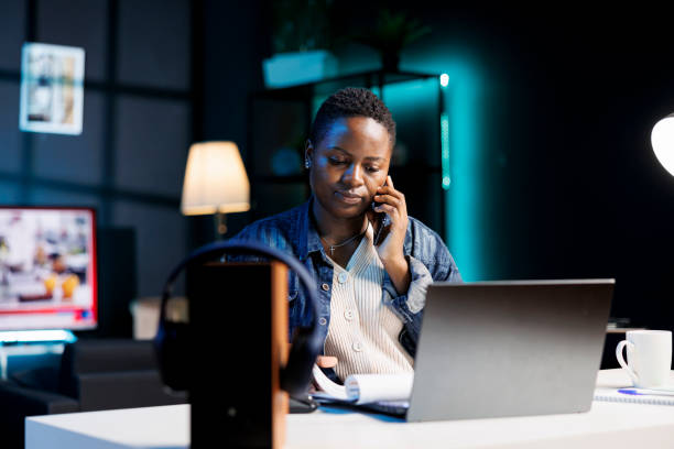istock Woman on a call and reviewing documents 1853387768