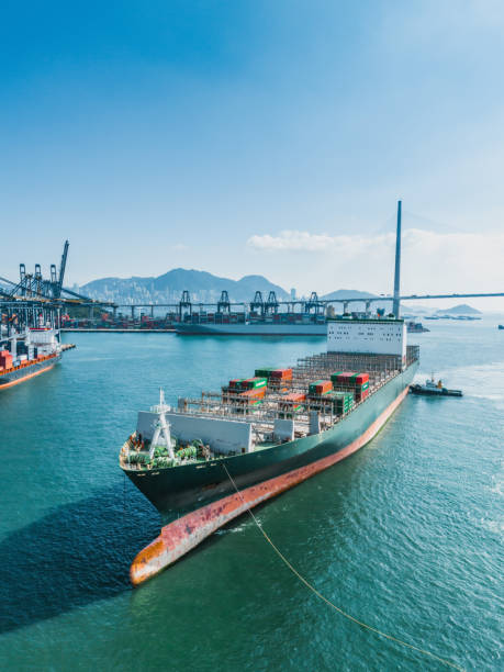 istock Container ship in import export and business logistic in Hong Kong 1853421893
