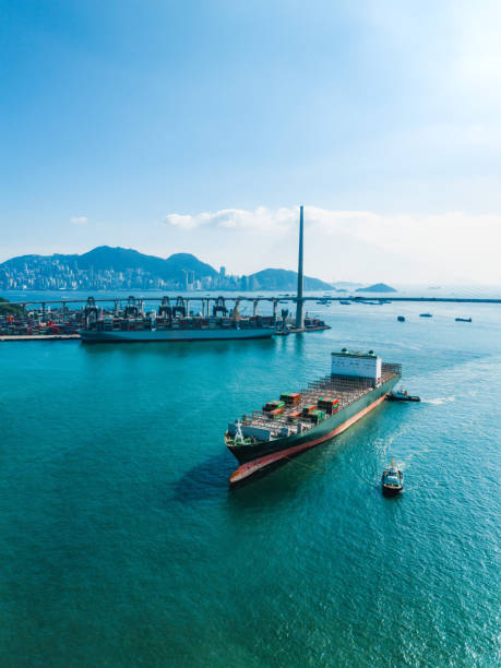 istock Container ship in import export and business logistic in Hong Kong 1853422399