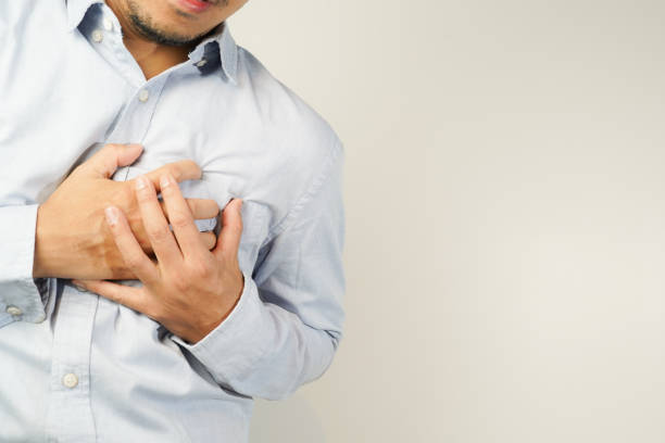 istock the man pressed his chest with a painful expression. Severe heartache, having a heart attack or painful cramps, heart disease 1853520521