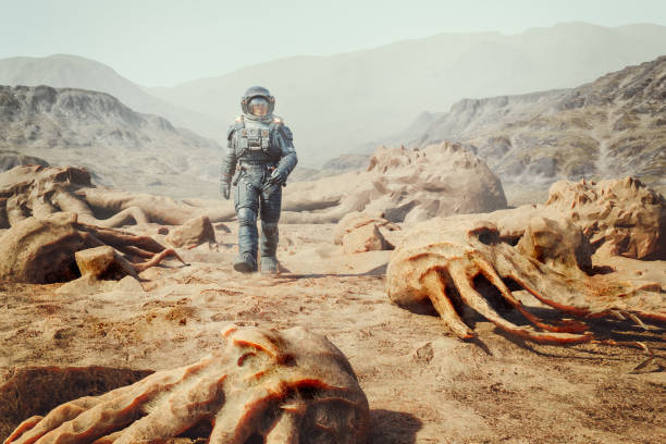 istock Astronaut walking on exo planet with dead alien creatures 1853550184