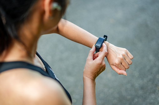 Close Up Of athlete Woman Checking Smart Watch Fitness Activity App