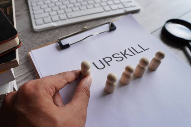 Closeup image of paper clipboard with text UPSKILL.