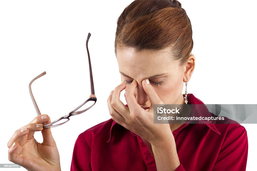 Young businesswoman suffering from eyestrain young businesswoman suffering from eyestrain Adult Stock Photo