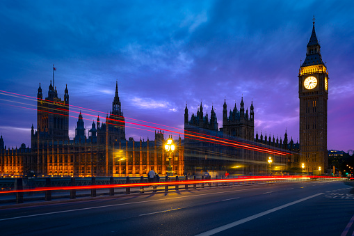 Exterior of historic buildings with lights against Big Ben tower in London city