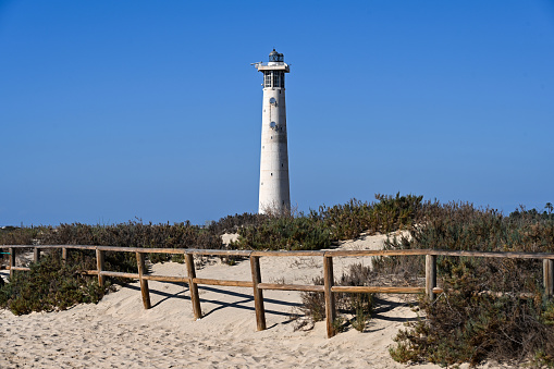 Jandia, Spain, November 27, 2023 - Lighthouse at Morro Jable Beach / Matorral Beach on the Jandia peninsula, Fuerteventura, Canary Islands, Spain.