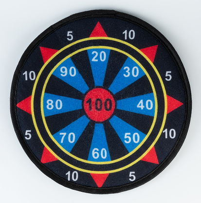 Dartboard isolated on white background. Vertical composition with copy space. Clipping path is included.