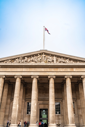 England, London - September 28, 2023: Facade exterior of British Museum with columns and against cloudless blue sky in London