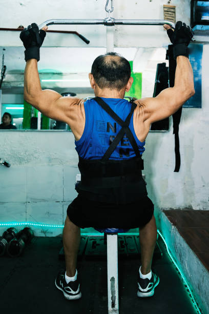istock Elderly person exercising in gym 1853787557