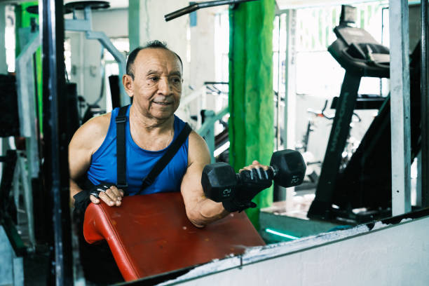 istock Elderly person exercising in gym 1853787558