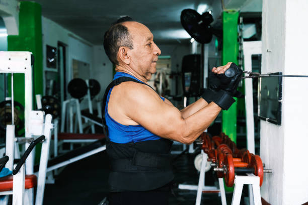 Elderly person exercising in gym
