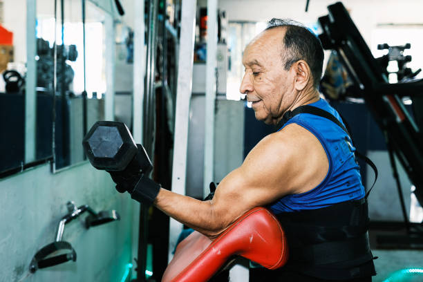 istock Elderly person exercising in gym 1853794737