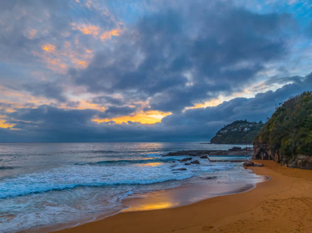 istock Northern Beaches Sunrise at the seaside with rain clouds 1853848849