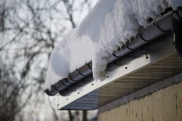 istock Heavy snow on the gutter and the roof surface 1853867844
