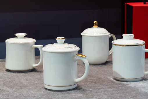 Elegant porcelain on the dining table, ceramic tableware, tea cups