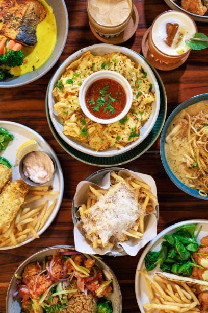 From a tabletop perspective, a diverse array of delicious cafe food is artfully displayed, creating an enticing spread of culinary delights.