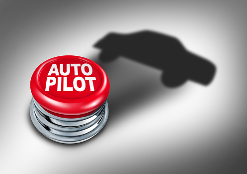 Autopilot And Auto Pilot driverless car driving technology and self driving AI as autonomous vehicle tech transportation as issues of safety and risk versus reward as a computer driver or human drivers.