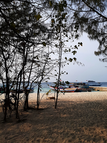 Fisherman boat docking at beach usually it carries domestic visitor.