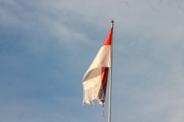 istock Old Indonesian flag on the wind 1854031153