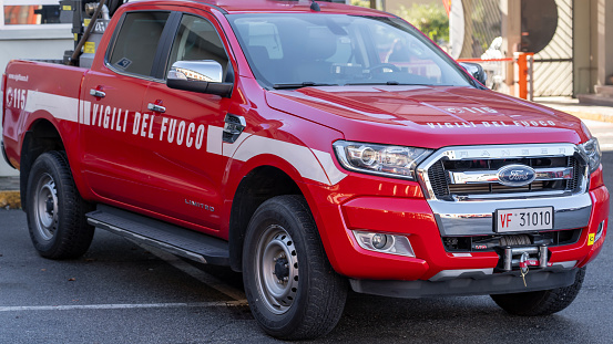 Red fire pick-up equipped with fire-fighting equipment ready to provide first aid in case of emergency. Italian firefighters or Vigili del fuoco