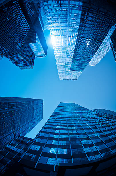 istock Blue tall Manhattan skyscraper against Sun 185405217