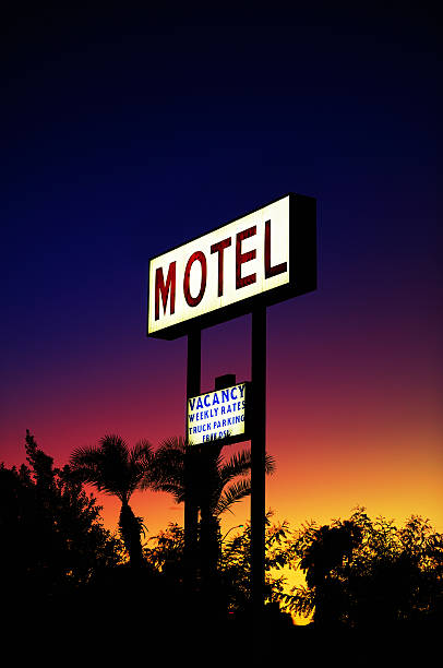 istock Hotel sign over sunset trees 185405250