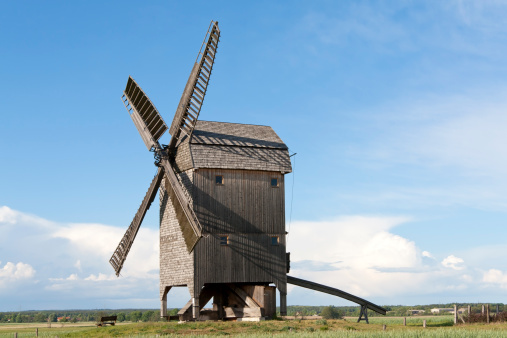 Summer Landscape with a historical windmill in the Havelland (Germany). (Was seen near the village Ketzuer, Brandenburg, Germany.) Originally windmills were developed for milling grain for food production. Often windmills are tenderly restored of the owners.