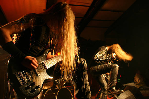 On stage Black metal band on stage bass guitar photos stock pictures, royalty-free photos & images