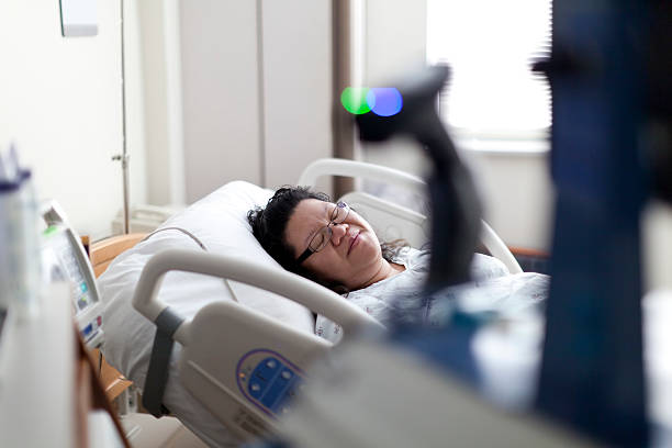 istock Woman in a hospital bed 185406150