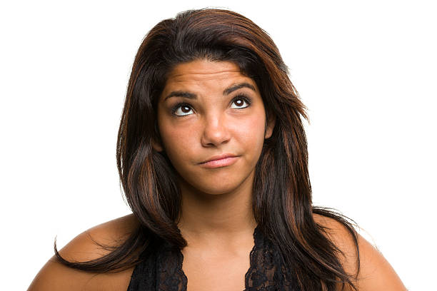 Daydreaming Young Woman Looks Up