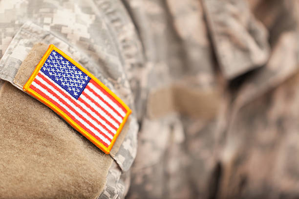 American Flag patch on American soldiers uniform camouflage clothing photos stock pictures, royalty-free photos & images