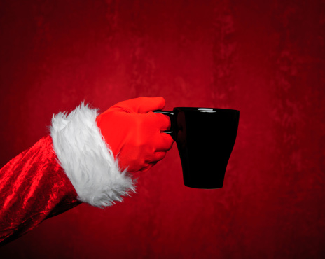 Santa hand holding different concepts on red background.