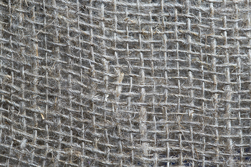 Background image. Rough fabric. Stranded threads.