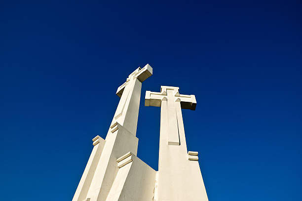 istock Two white crosses in front of the sky 185406974