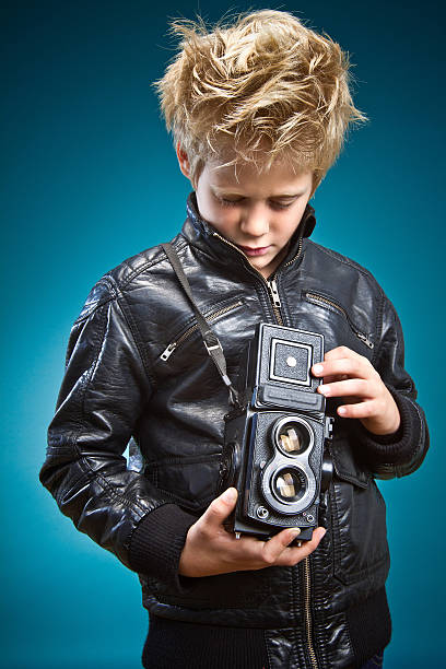 Boy with a camera stock photo