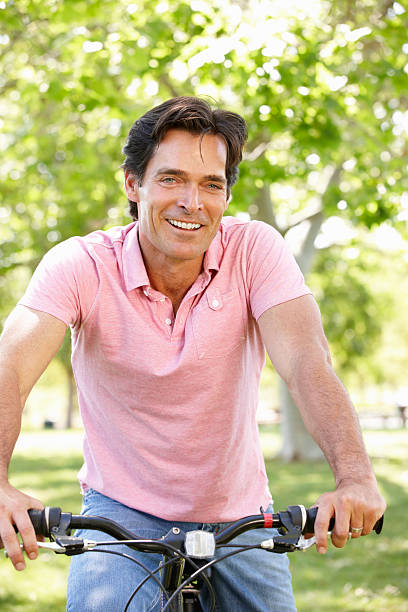 istock Man riding bike 185407587