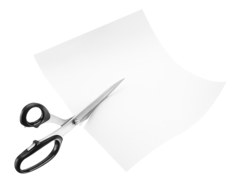 scissors cutting through blank paper isolated on white