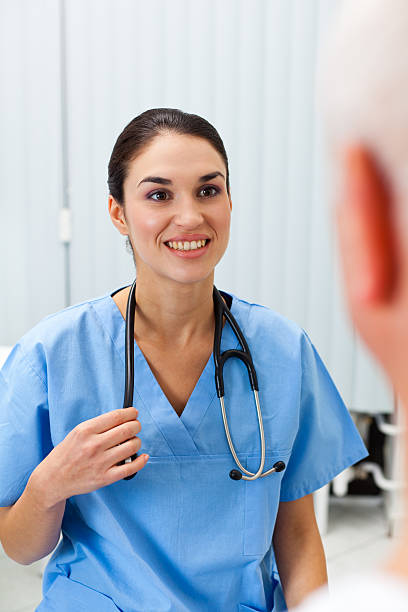 istock Nurse talking with senior patient 185408110