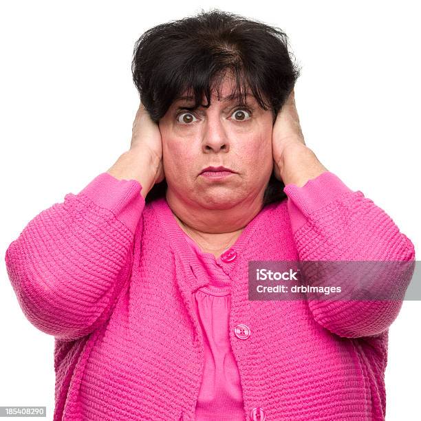 Woman Covering Ears Stock Photo - Download Image Now - Hands Covering Ears, Noise, 50-54 Years