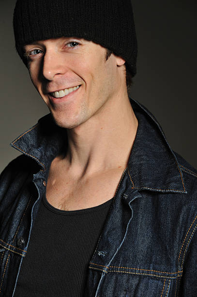 istock Portrait of handsome young man with denim jacket and hat 185408739